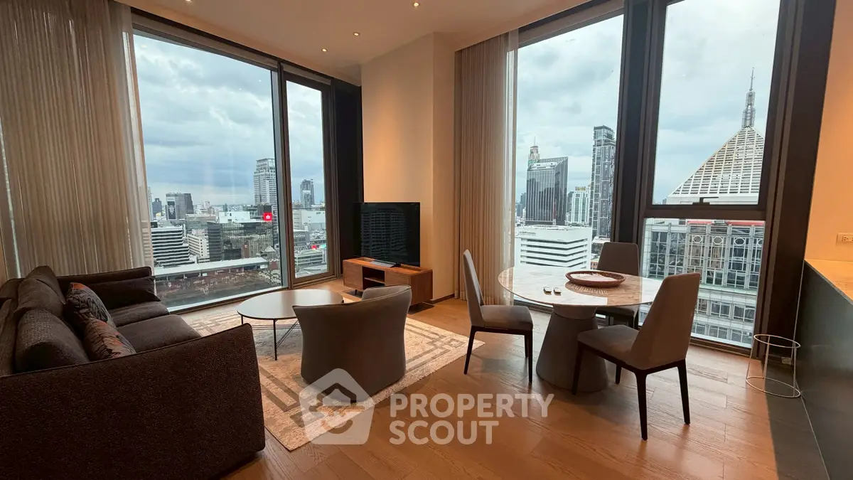 Luxurious living room with stunning city view, featuring modern furniture and floor-to-ceiling windows.