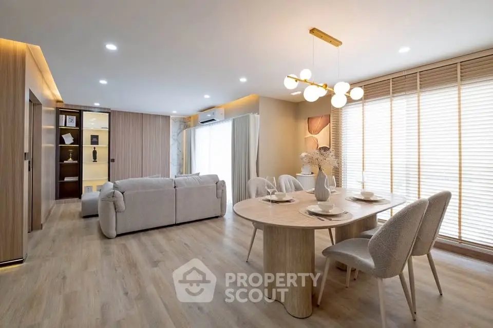 Spacious modern living room with elegant dining area and natural light