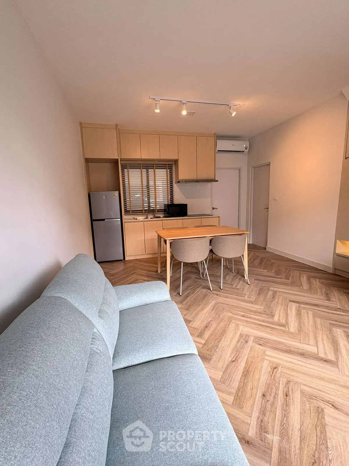 Modern apartment interior with cozy living area and stylish kitchen