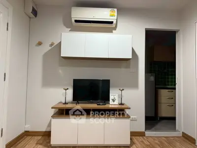 Modern living room with sleek furniture and air conditioning unit, perfect for cozy urban living.