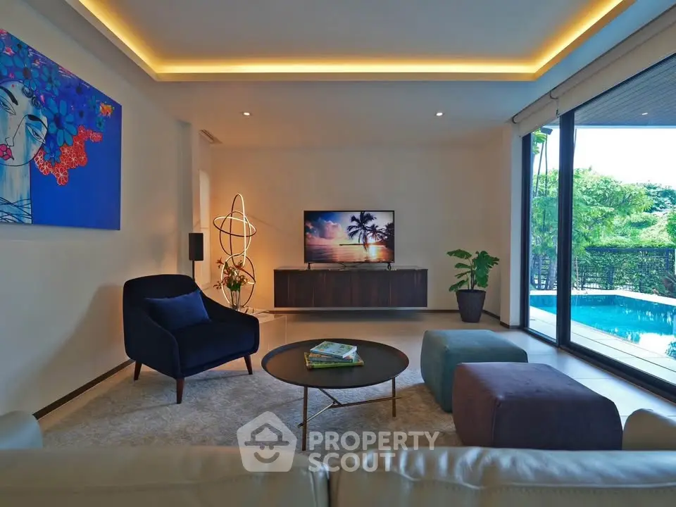 Luxurious living room with pool view, modern decor, and ambient lighting.