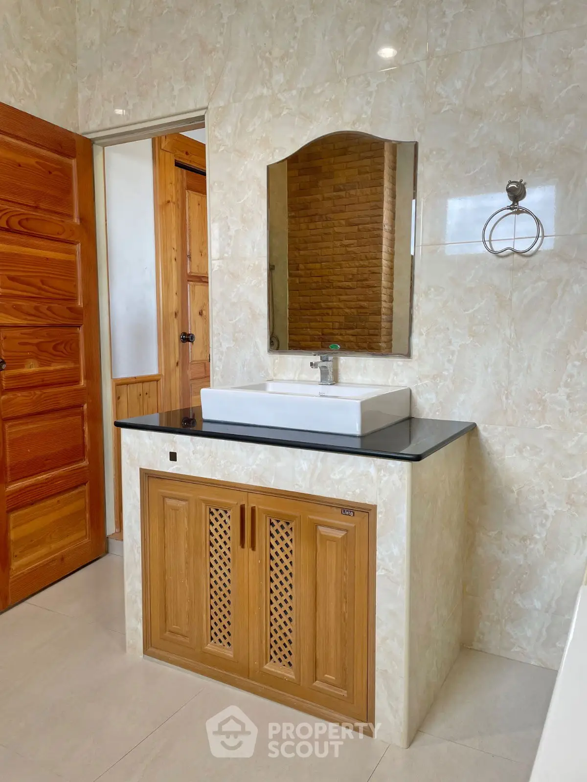 Elegant bathroom with wooden accents and modern sink design