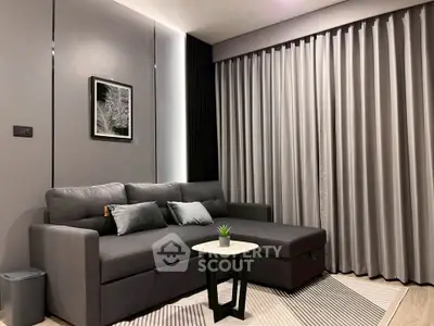 Modern living room with sleek gray sofa and stylish decor
