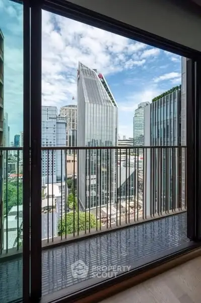 Stunning cityscape view from modern balcony in urban high-rise apartment.