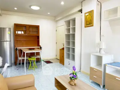 Bright and cozy living room with modern furniture and dining area, perfect for urban living.