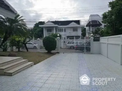 Spacious driveway with elegant entrance in a suburban neighborhood