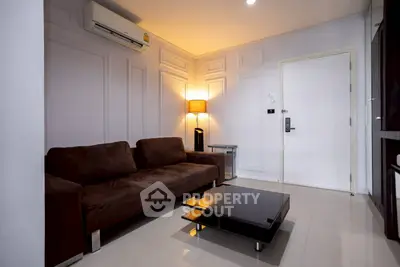 Modern living room with brown sofa and sleek coffee table