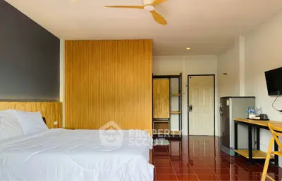 Spacious modern bedroom with wooden accents and sleek furnishings