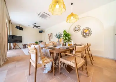 Spacious and stylish dining area with modern decor and natural lighting