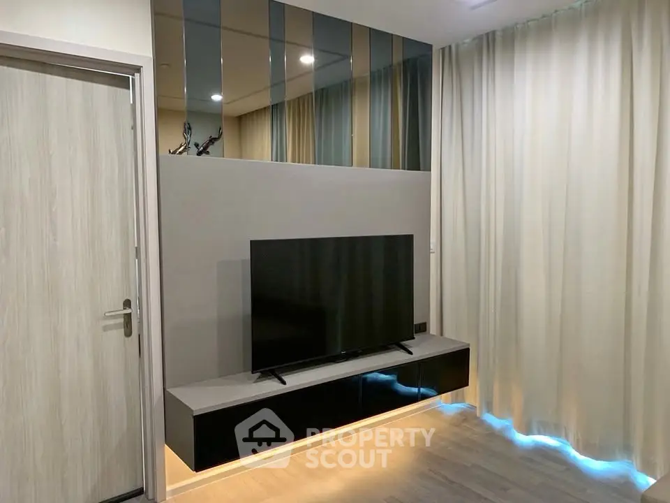 Modern living room with sleek TV unit and ambient lighting
