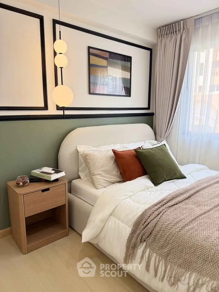Cozy bedroom with modern decor, featuring a stylish bed, elegant lighting, and a serene ambiance.