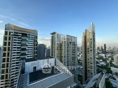 Stunning cityscape view from a high-rise building showcasing modern architecture and urban skyline.
