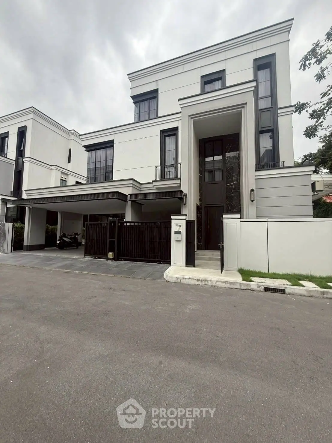 Luxurious modern villa with sleek design and spacious driveway