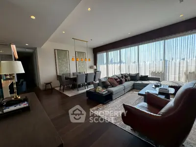 Luxurious living room with modern decor and large windows offering abundant natural light.