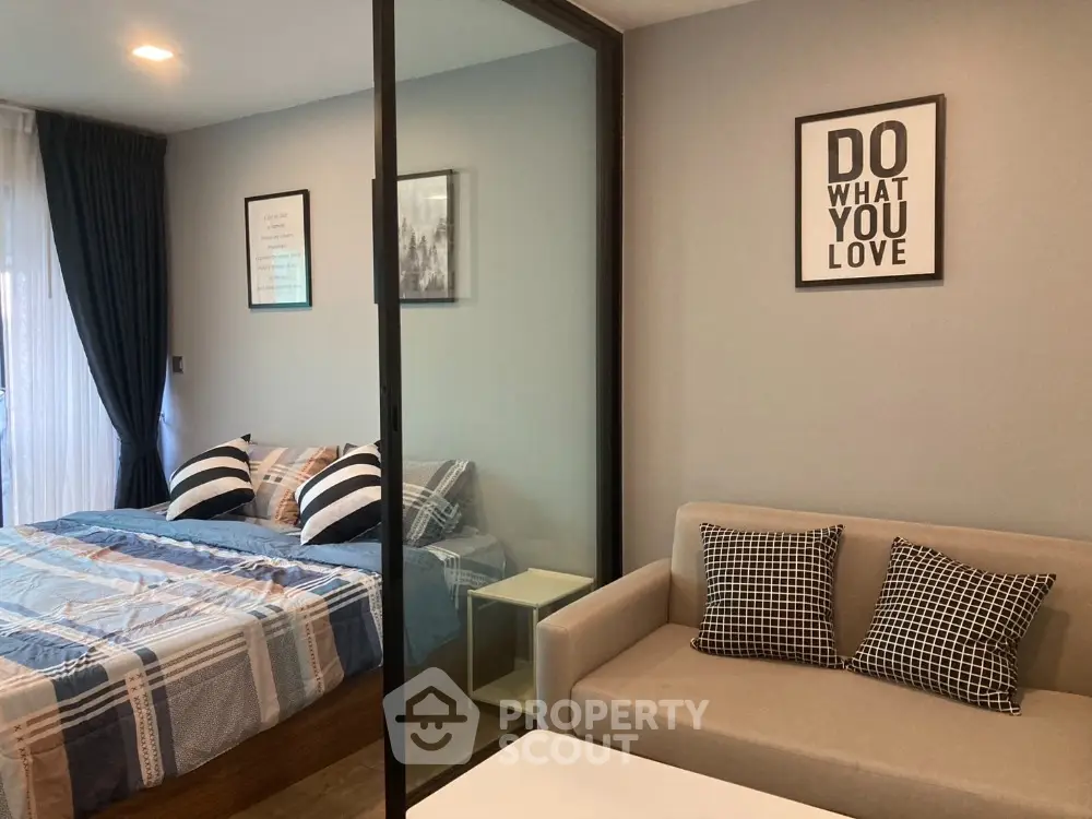 Modern bedroom with cozy sofa and stylish decor in a chic apartment