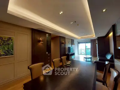 Spacious modern living room with elegant dining area and balcony view.