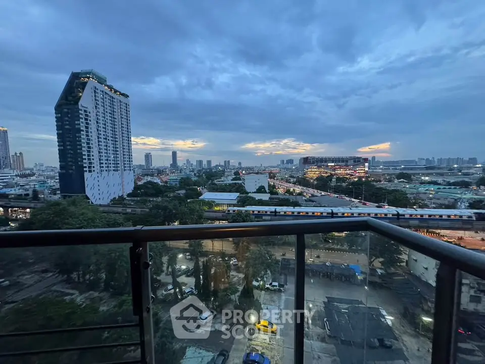 Stunning cityscape view from a high-rise balcony at dusk, showcasing urban skyline and vibrant city life.