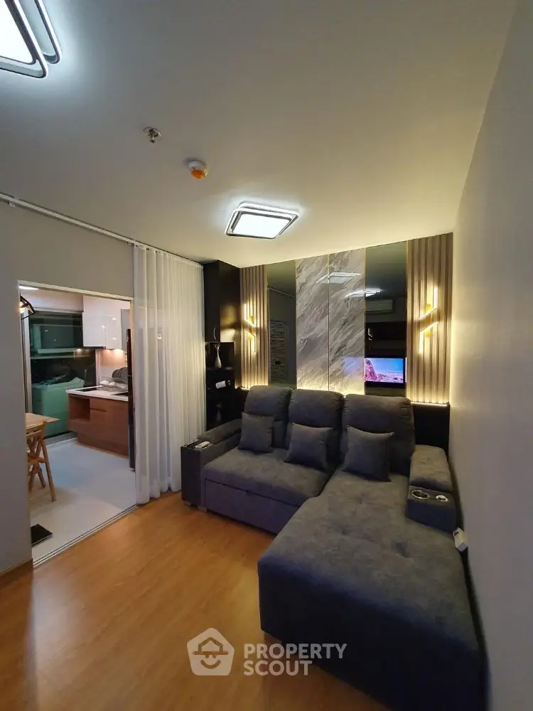 Modern living room with cozy sectional sofa and stylish lighting