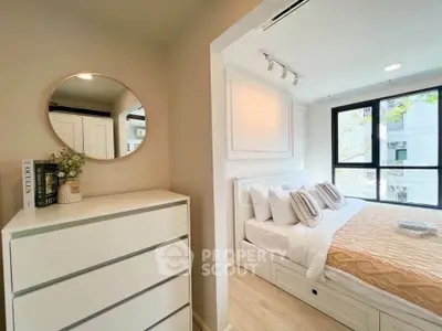Bright and cozy bedroom with modern decor and large window view