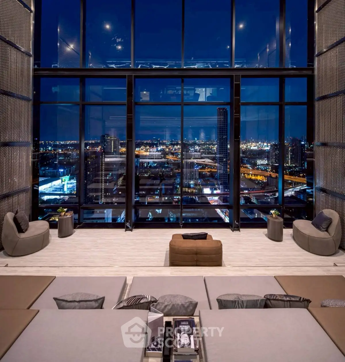 Luxurious high-rise living room with stunning city skyline view at night