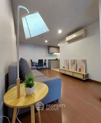 Modern living room with stylish decor and open kitchen layout