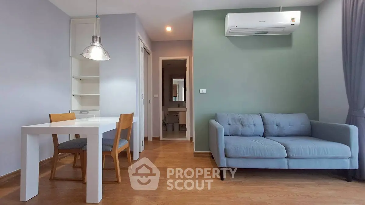 Modern living room with stylish furniture and air conditioning in a cozy apartment.