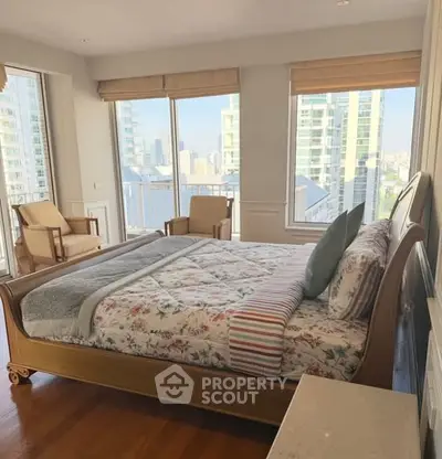 Luxurious bedroom with stunning city view and elegant decor