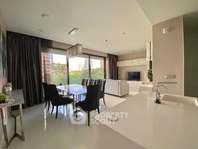 Luxurious open-plan living room with modern dining area and stunning city view.