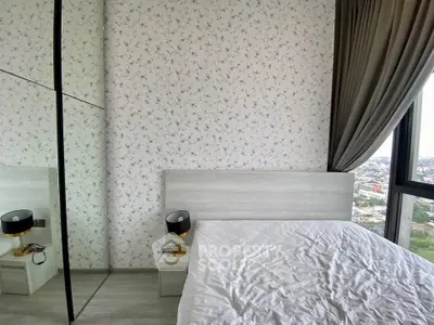 Modern bedroom with city view, featuring stylish wallpaper and elegant bedside lamps.