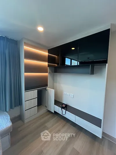 Modern bedroom with built-in storage and sleek design
