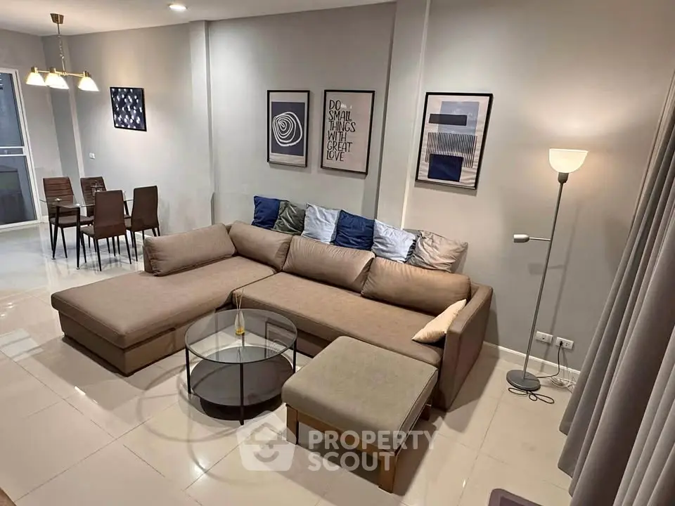 Modern living room with stylish decor and cozy sectional sofa in a contemporary apartment.
