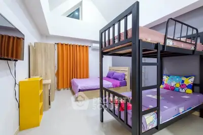 Spacious bedroom with bunk beds and vibrant decor, perfect for family living.