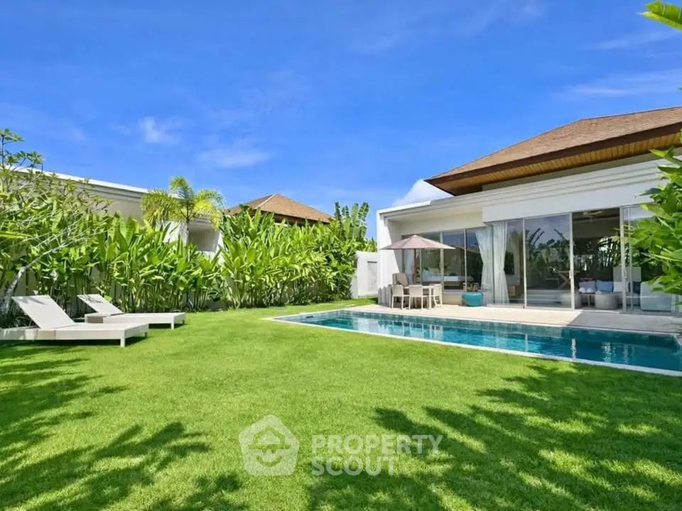 Luxurious villa with private pool and lush garden, perfect for tropical living.