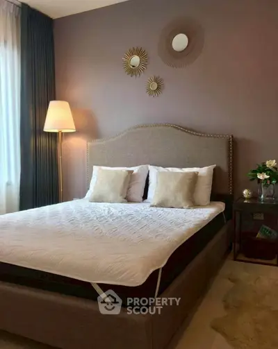 Elegant bedroom with stylish decor and cozy lighting, perfect for relaxation and comfort.
