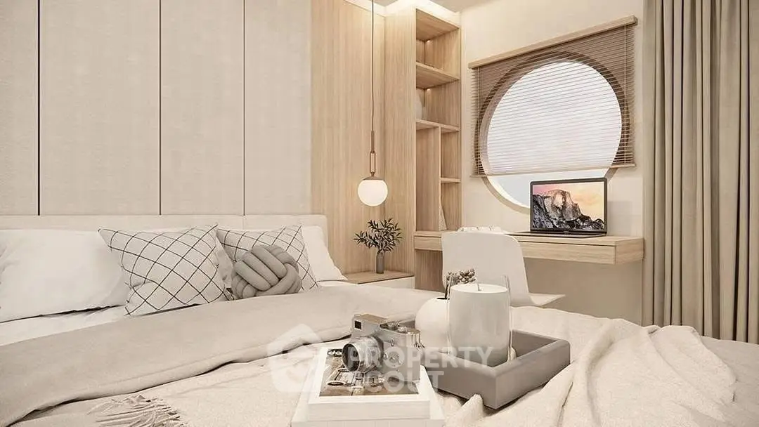 Modern bedroom with cozy decor, featuring a round window and stylish workspace.