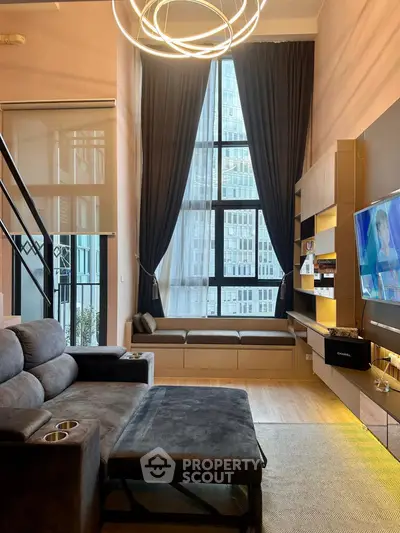 Luxurious modern living room with high ceilings and large windows in urban apartment