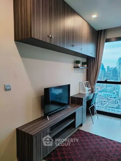 Modern living room with city view, sleek furniture, and stylish decor
