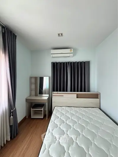 Modern bedroom with stylish furniture and natural light, featuring a comfortable mattress and elegant curtains.