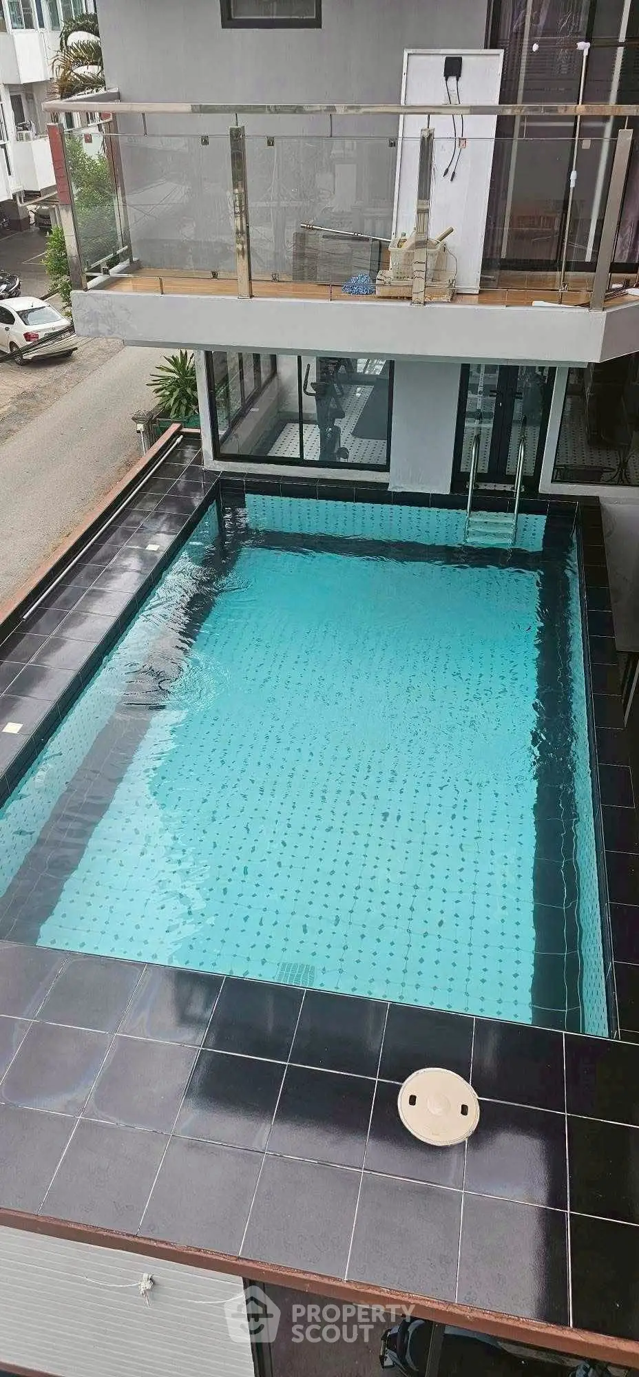 Luxurious modern building with a stunning rooftop pool offering a serene urban escape.