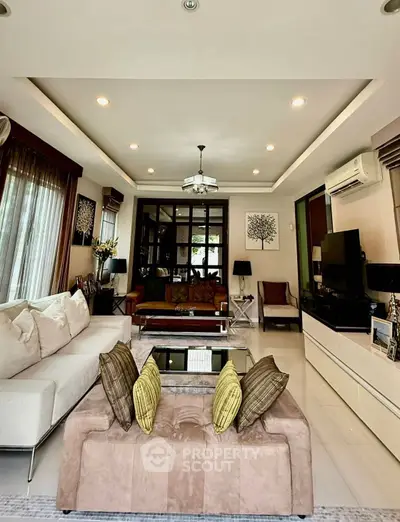 Luxurious living room with elegant decor and ample natural light