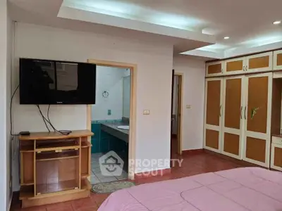 Spacious bedroom with ensuite bathroom and built-in wardrobe, perfect for modern living.
