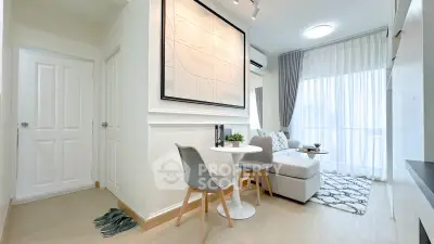Modern living room with cozy seating and stylish decor in a bright apartment