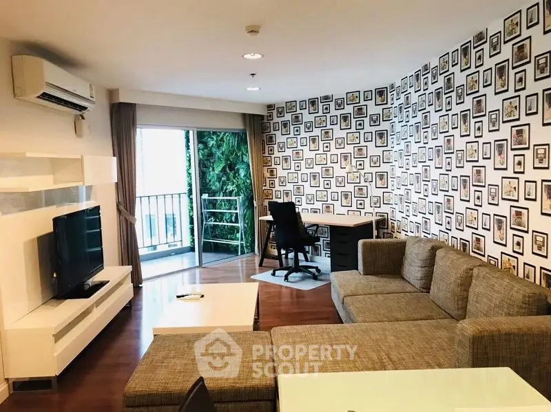 Spacious living room with modern decor and balcony access, ideal for relaxation and entertainment.