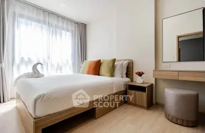 Modern bedroom with natural light, stylish decor, and cozy ambiance for ultimate relaxation.