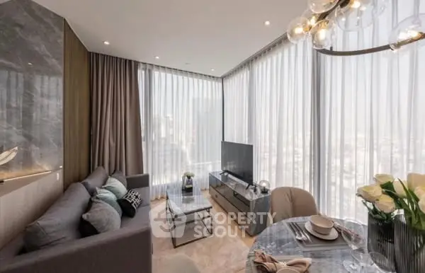 Luxurious modern living room with panoramic city views and elegant decor.
