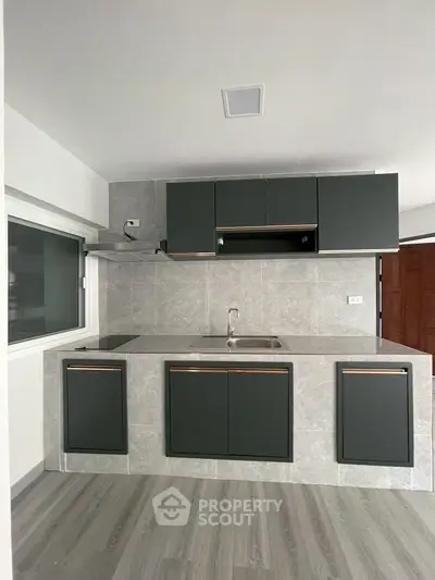 Modern kitchen with sleek cabinetry and minimalist design