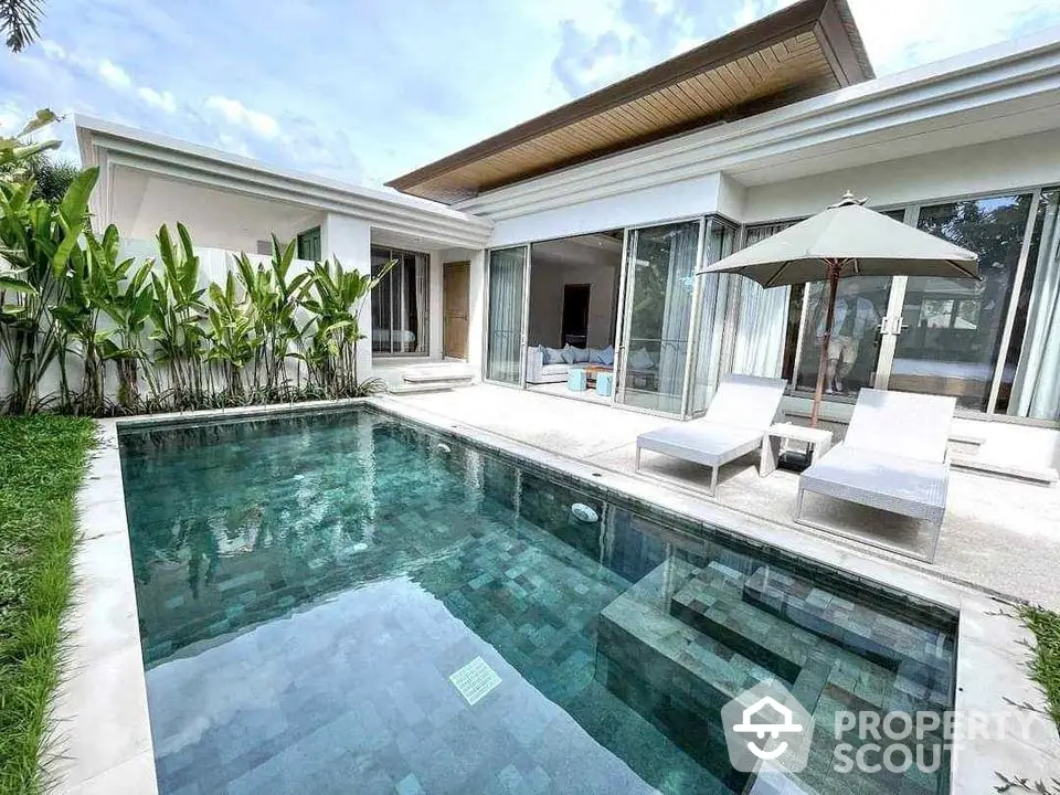 Luxurious modern villa with private pool and lush garden, perfect for relaxation and leisure.