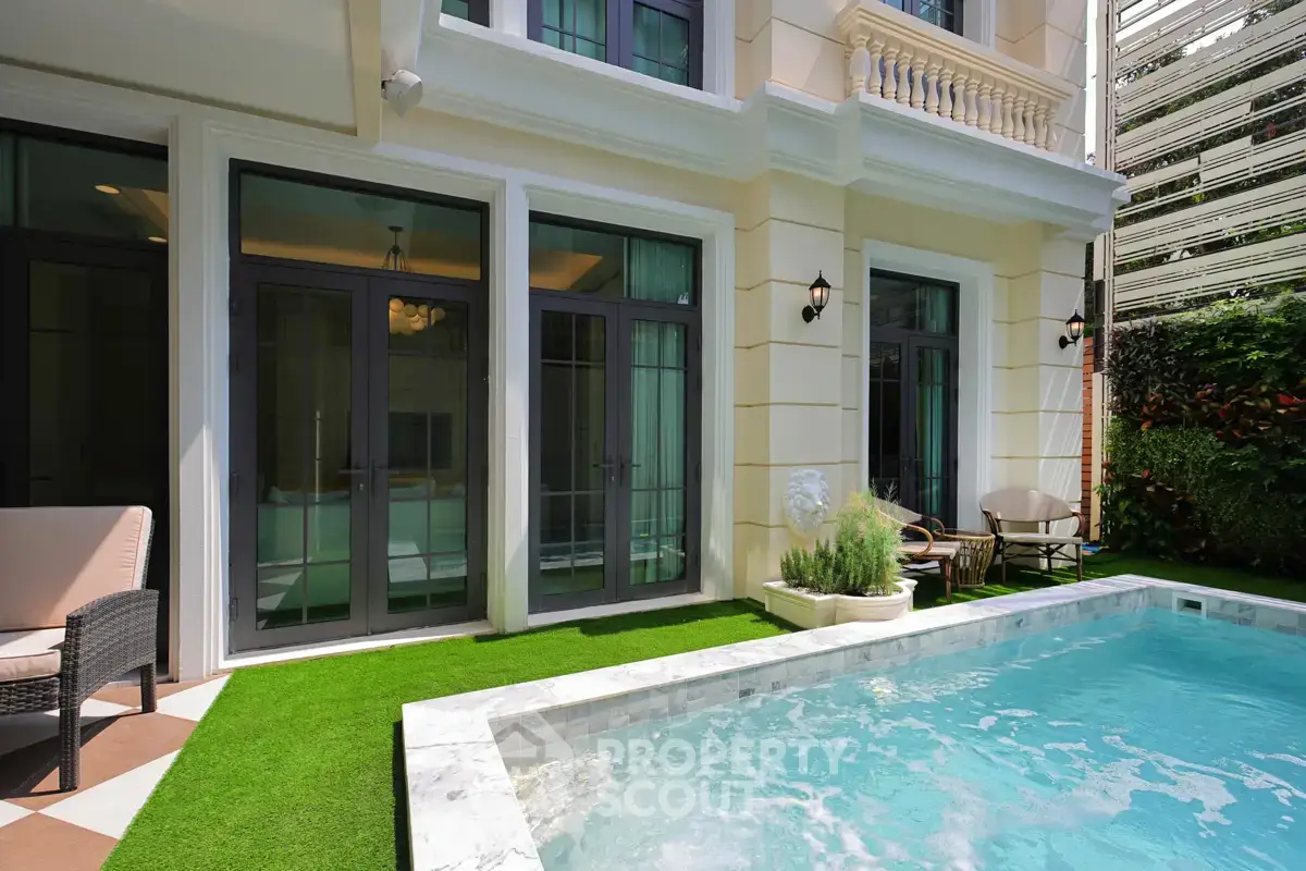 Luxurious villa exterior with private pool and elegant garden setting