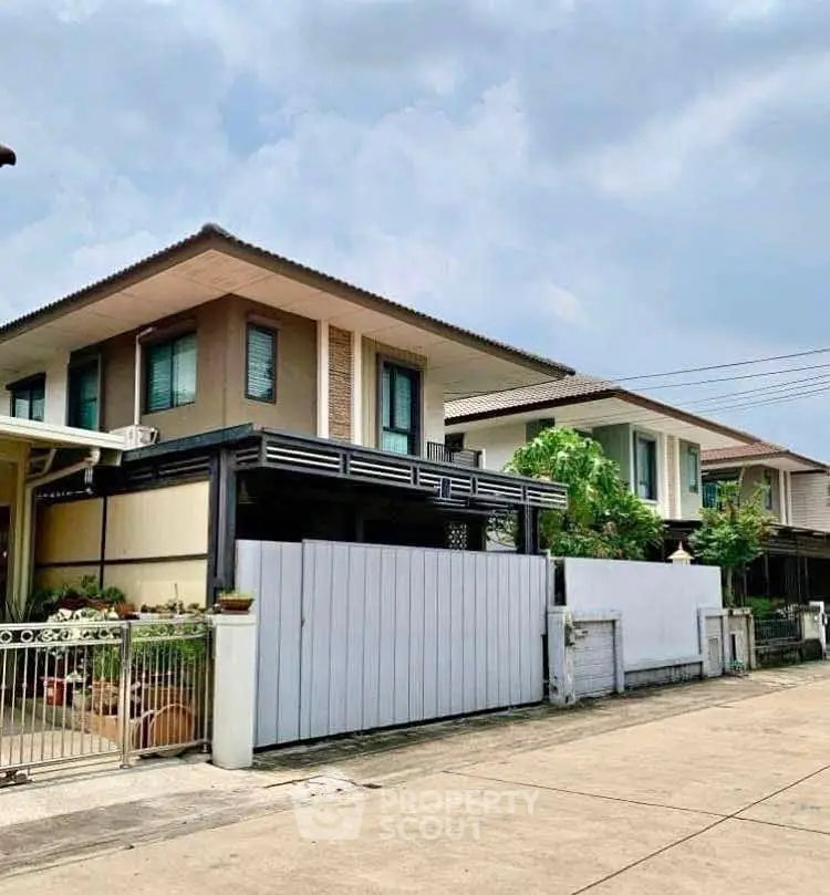 Charming suburban two-story homes with modern design and lush greenery in a peaceful neighborhood.