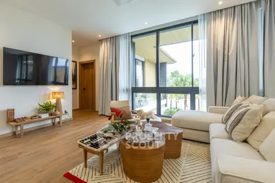 Spacious modern living room with large windows and stylish decor